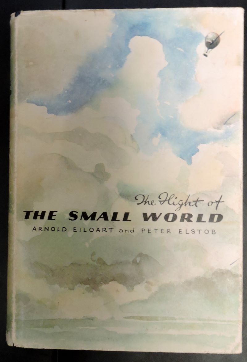 Picture of the dust wrapper showing a tiny balloon high up amongst clouds above the title and authors in black text